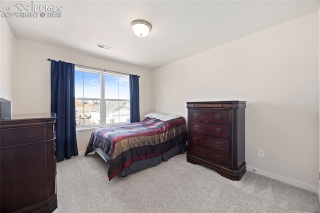 bedroom with carpet, visible vents, and baseboards