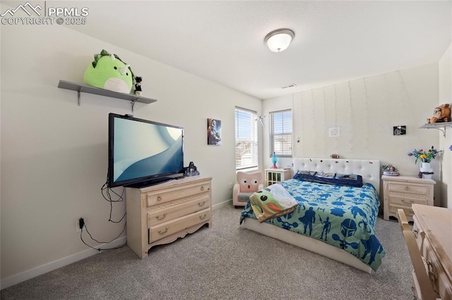 bedroom with carpet floors and baseboards