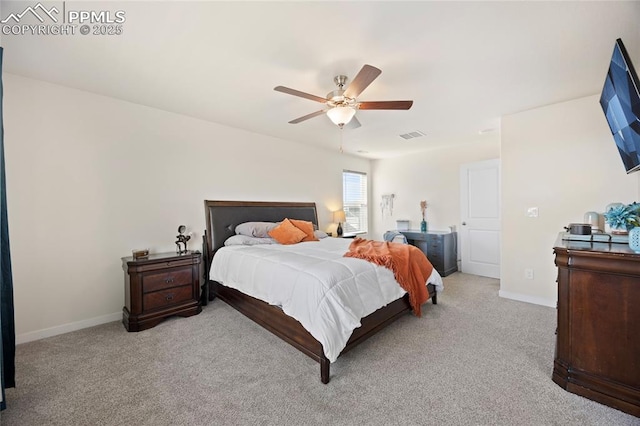 bedroom with carpet, visible vents, baseboards, and a ceiling fan