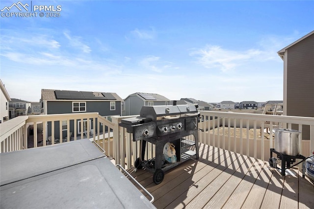 wooden terrace with a residential view