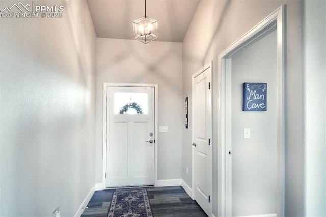 doorway to outside with dark wood-style floors and baseboards