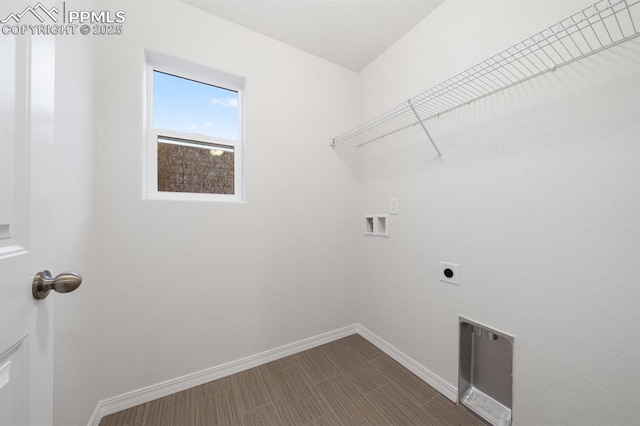 laundry room with laundry area, washer hookup, hookup for an electric dryer, and baseboards