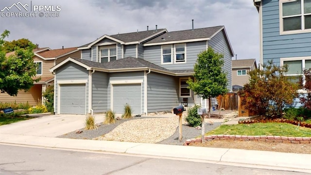 view of front facade with a garage and concrete driveway