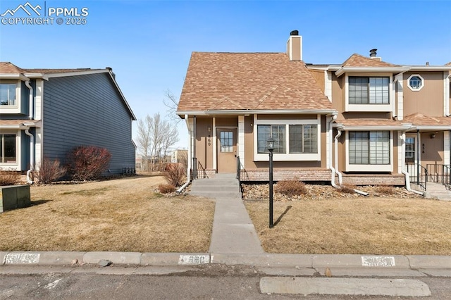 view of front of property with roof with shingles and stucco siding