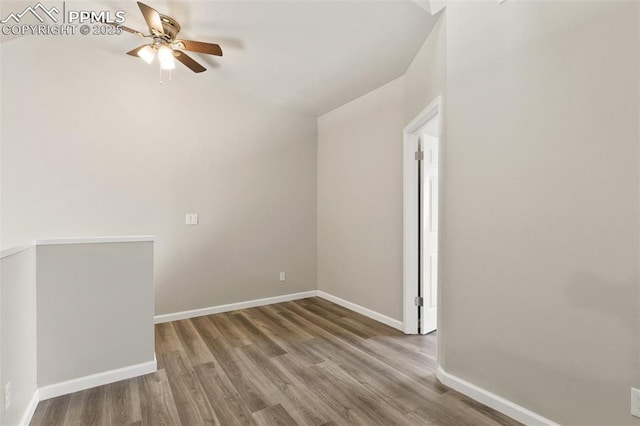 unfurnished room featuring ceiling fan, baseboards, and wood finished floors