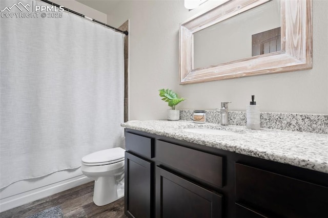1086 N Purcell Blvd, Pueblo West, CO 81007 - bathroom featuring vanity, shower / tub combo, wood finished floors, and toilet