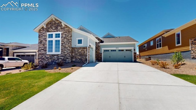 view of front of property with a garage, a front lawn, and concrete driveway