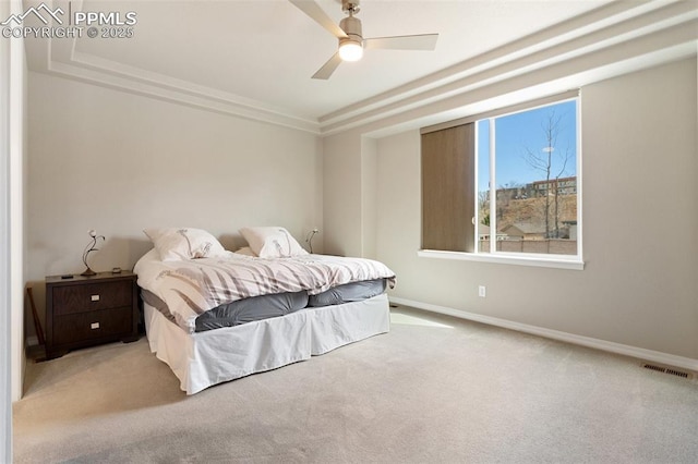 bedroom featuring crown molding, visible vents, a ceiling fan, carpet flooring, and baseboards