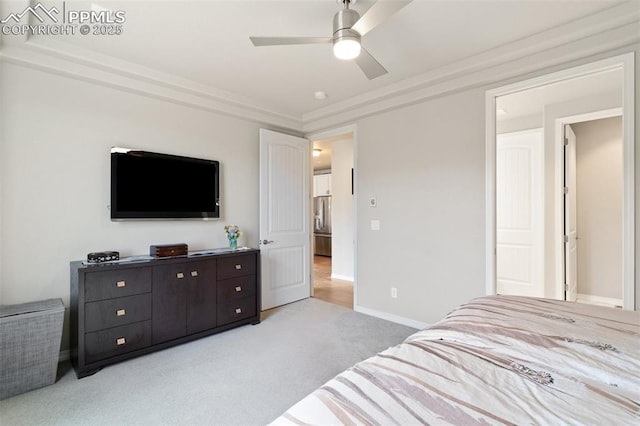 bedroom featuring stainless steel fridge, carpet flooring, a ceiling fan, and baseboards