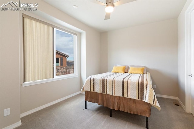 carpeted bedroom with ceiling fan, visible vents, and baseboards