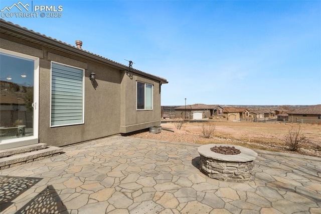 view of patio / terrace with a fire pit