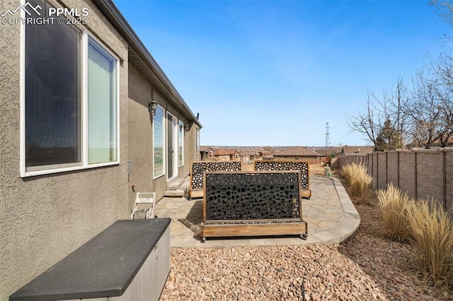 view of yard featuring a patio area and a fenced backyard