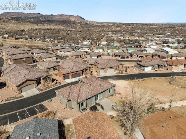 bird's eye view featuring a mountain view and a residential view