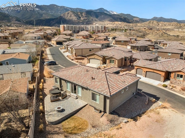 drone / aerial view with a residential view and a mountain view