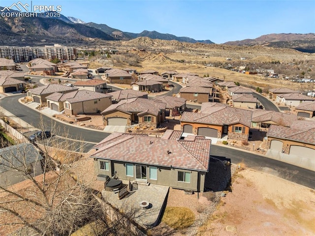 birds eye view of property featuring a residential view and a mountain view