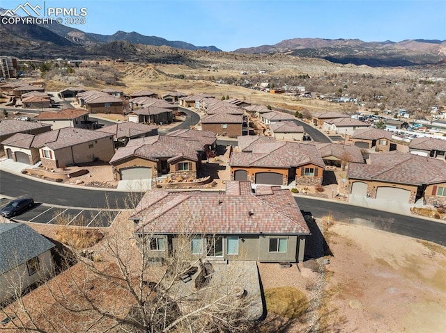 aerial view with a residential view and a mountain view