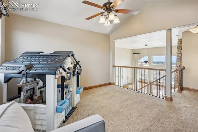 workout room with vaulted ceiling, carpet floors, a ceiling fan, and baseboards