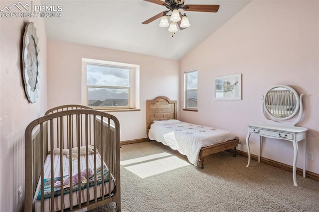 carpeted bedroom featuring lofted ceiling, ceiling fan, and baseboards