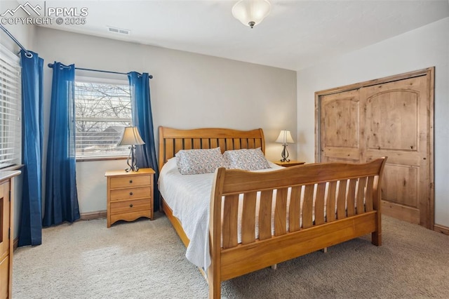 carpeted bedroom with visible vents