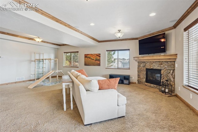 carpeted living area featuring ornamental molding, a fireplace, visible vents, and baseboards