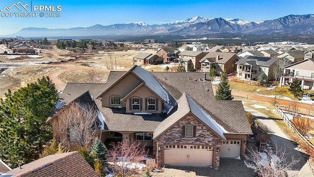 birds eye view of property with a residential view and a mountain view