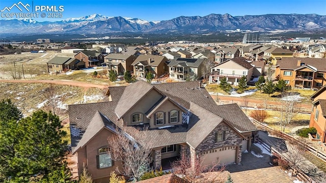 birds eye view of property with a residential view and a mountain view