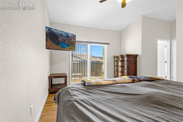 bedroom with baseboards, ceiling fan, access to exterior, a textured wall, and light wood-type flooring