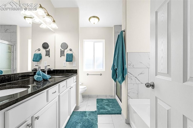 full bath with a sink, marble finish floor, and a stall shower