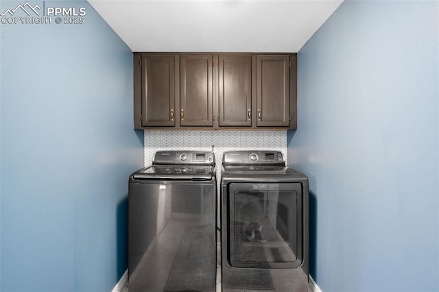 laundry area with cabinet space and washer and clothes dryer