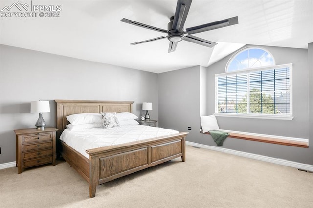 bedroom featuring light colored carpet, visible vents, lofted ceiling, and baseboards