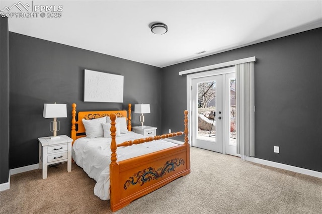 carpeted bedroom with access to exterior, visible vents, and baseboards