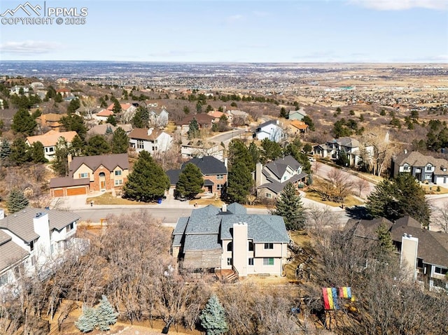 birds eye view of property with a residential view