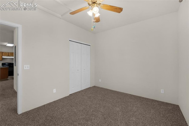 unfurnished bedroom featuring a closet, ceiling fan, and carpet floors