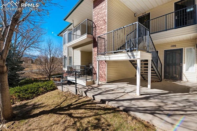 view of home's exterior with stairs