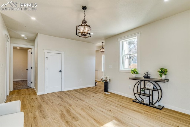 interior space featuring wood finished floors and baseboards