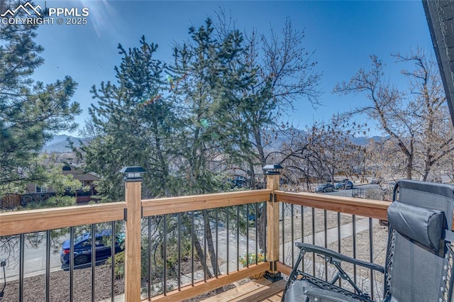 wooden terrace featuring a mountain view