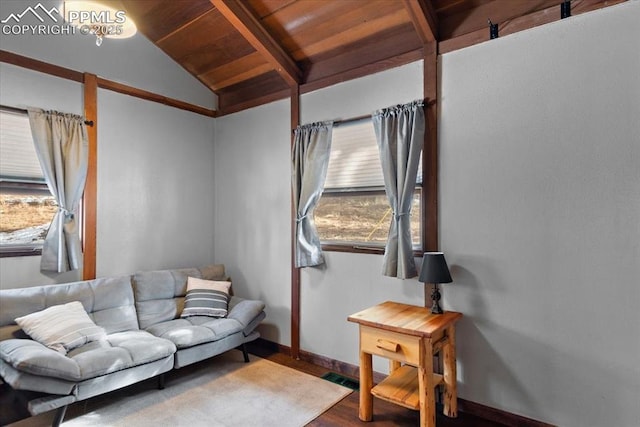 living room featuring visible vents, lofted ceiling with beams, wood finished floors, wooden ceiling, and baseboards