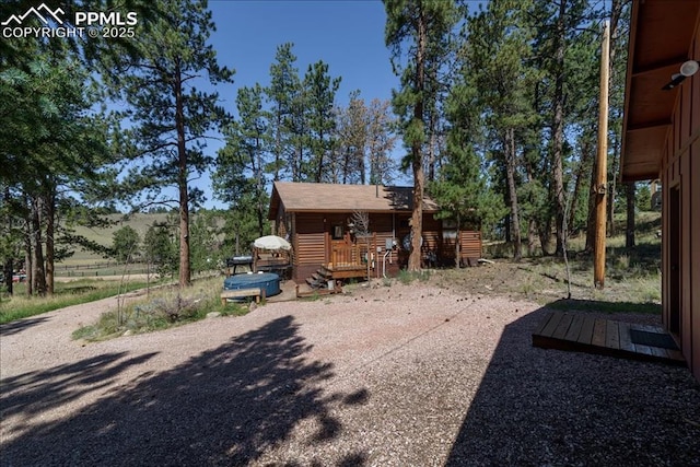 rear view of house with a wooden deck