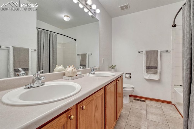 full bathroom featuring tile patterned flooring, visible vents, and a sink