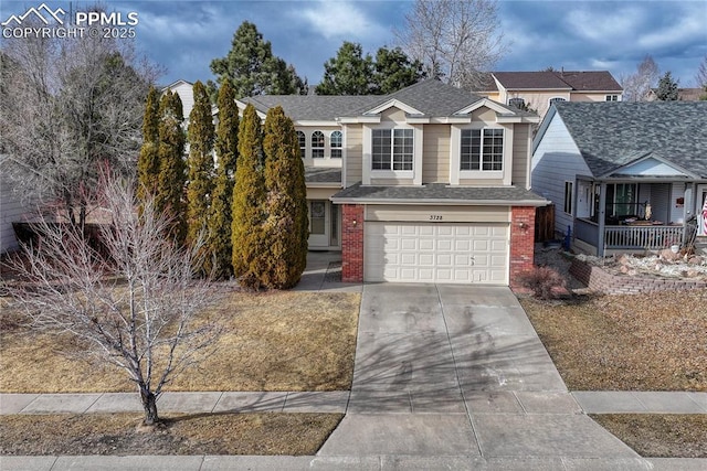 traditional home with a porch, an attached garage, brick siding, a shingled roof, and driveway