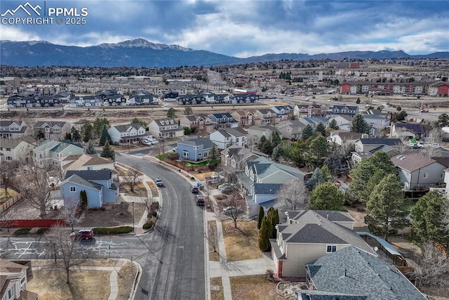 drone / aerial view with a residential view and a mountain view