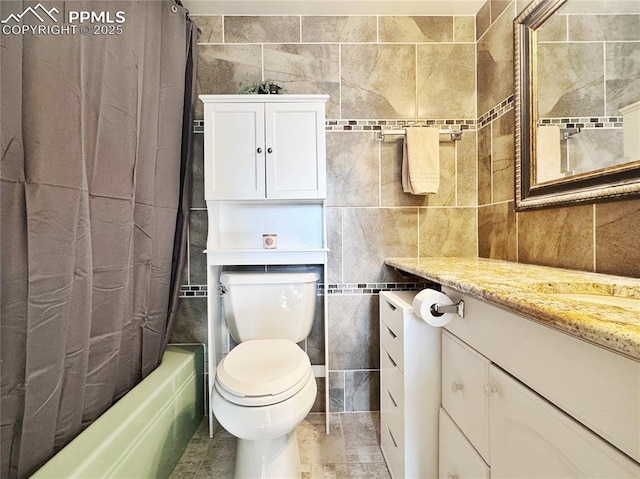 bathroom featuring shower / tub combo with curtain, tile walls, toilet, and vanity