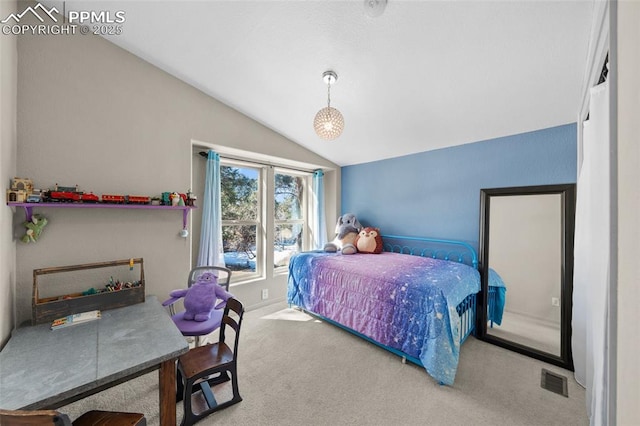 bedroom with visible vents, lofted ceiling, and carpet