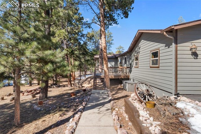view of yard with a wooden deck