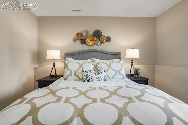 bedroom with visible vents