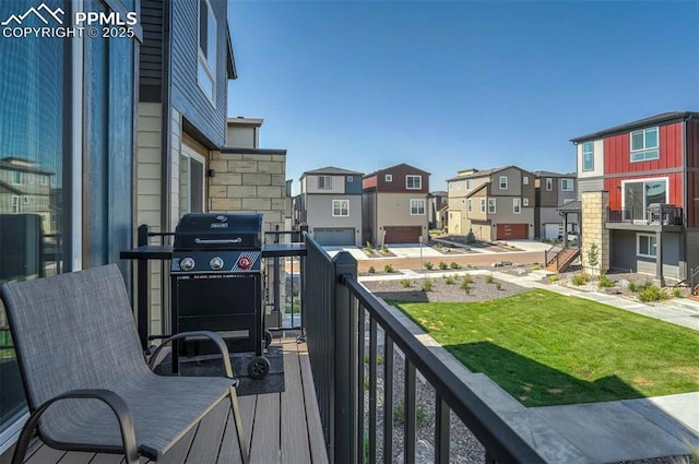 balcony with grilling area and a residential view