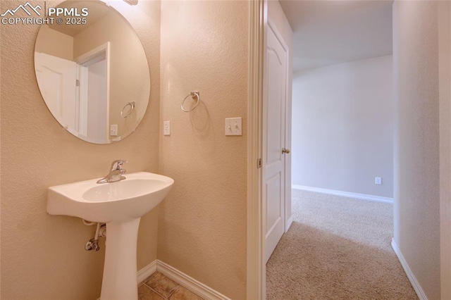 bathroom featuring baseboards