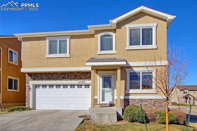 view of front of property featuring a garage, stone siding, driveway, and stucco siding