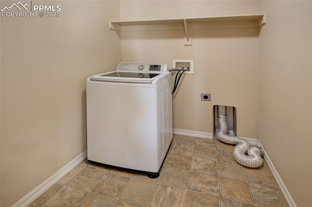 laundry area featuring laundry area, washer / dryer, and baseboards