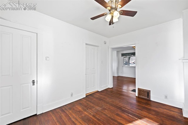 unfurnished room with hardwood / wood-style flooring, baseboards, and visible vents